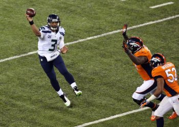 Feb 2, 2014; East Rutherford, NJ, USA; Seattle Seahawks quarterback Russell Wilson (3) throws against the Denver Broncos during the second quarter in Super Bowl XLVIII at MetLife Stadium. Mandatory Credit: Noah K. Murray-USA TODAY Sports