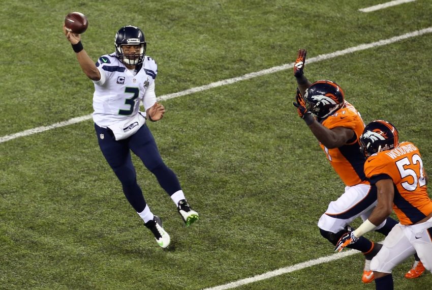 Feb 2, 2014; East Rutherford, NJ, USA; Seattle Seahawks quarterback Russell Wilson (3) throws against the Denver Broncos during the second quarter in Super Bowl XLVIII at MetLife Stadium. Mandatory Credit: Noah K. Murray-USA TODAY Sports